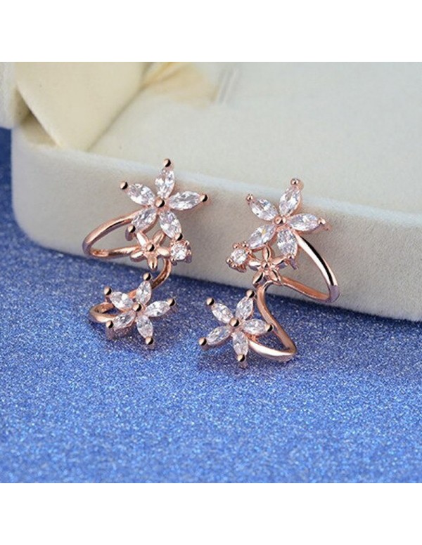 Jewels Galaxy Rose Gold Plated American Diamond Studded Triple Star Shaped Earrings