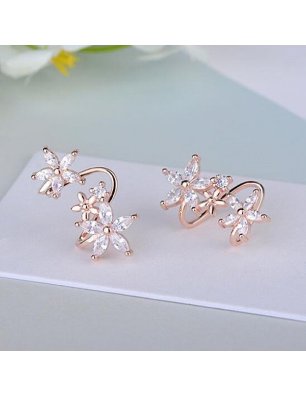 Jewels Galaxy Rose Gold Plated American Diamond Studded Triple Star Shaped Earrings