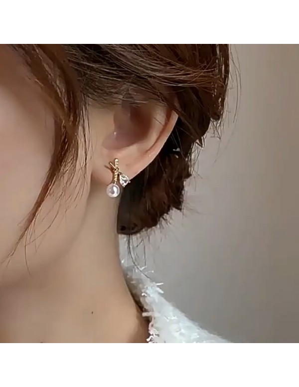 Jewels Galaxy Gold Plated American Diamond Studded Cross Shape Korean Stud Earrings
