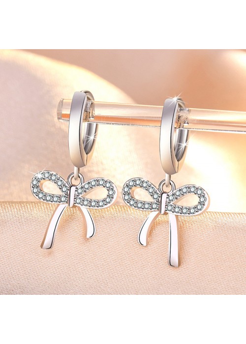 Jewels Galaxy Silver Plated American Diamond Studded Bow-Tie Shape Korean Stud Earrings